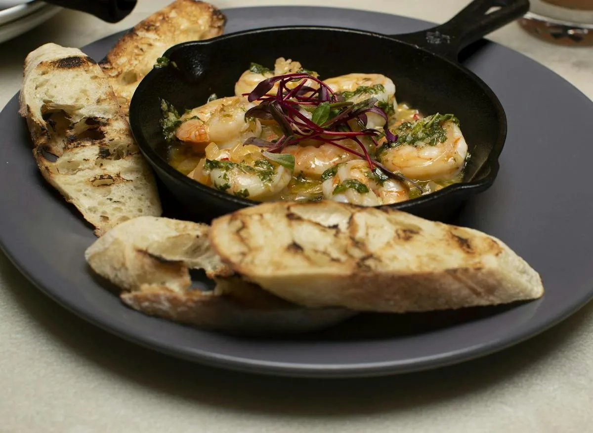 Garlic shrimp and toasted bread served at Uptown Lobby